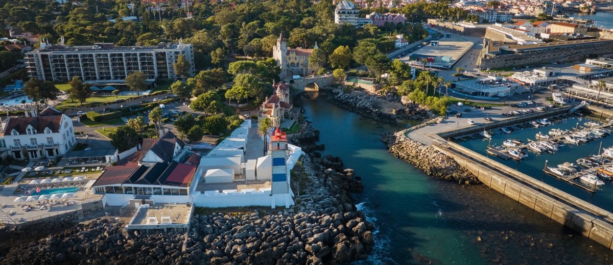 The Santa Marta lighthouse and the houses along the Cascais coast from the air